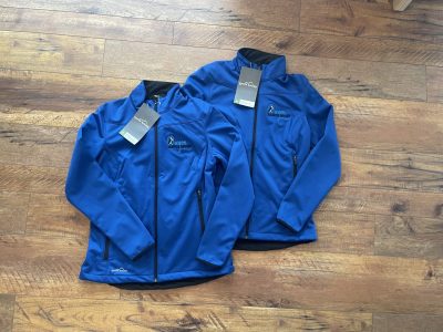 Royal blue Eddie Bauer softshell jackets with embroidered Oregon Dancesport logo