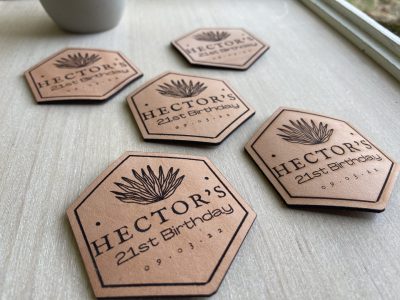 Laser engraved hexagon leather coasters personalized for 21st birthday party with agave plant design