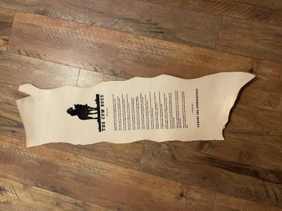 Laser engraved leather cowhide with The Cow Boss cowboy poem and horse silhouette memorial