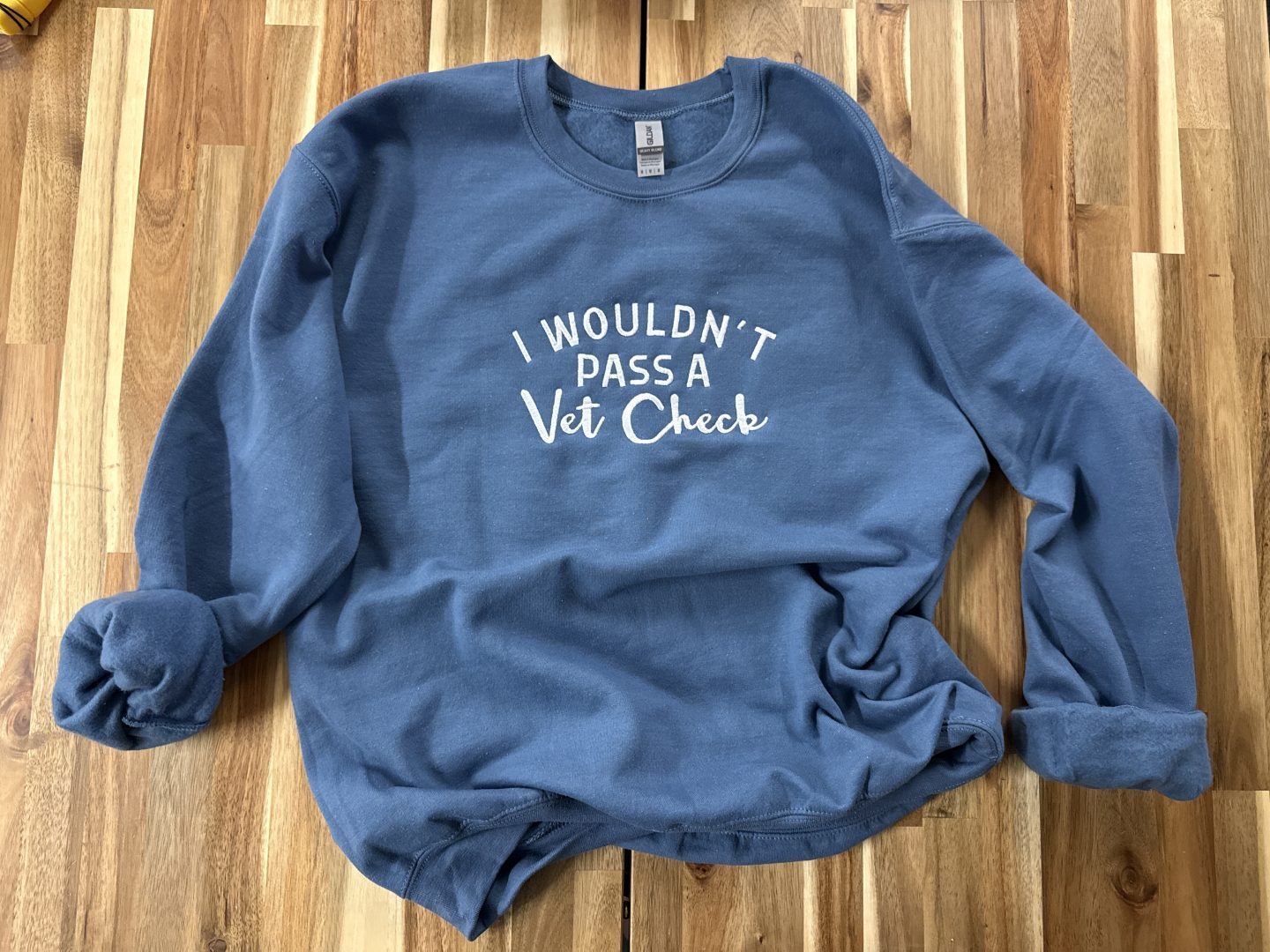 Blue sweatshirt with screen printed I Wouldn't Pass A Vet Check funny equestrian horse humor