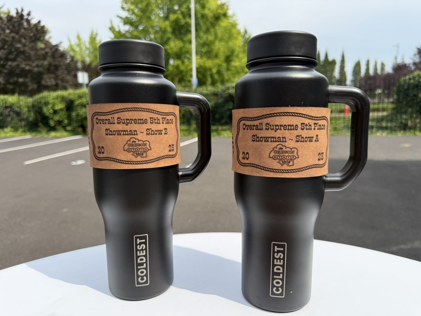 Black Coldest tumblers with laser engraved leather sleeves Oregon State Fair Overall Supreme Showman awards