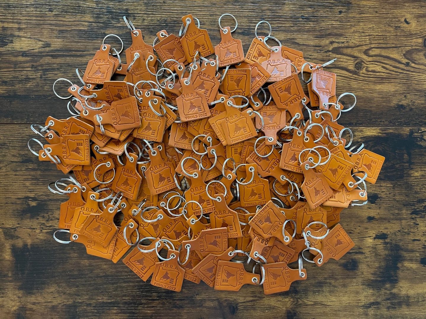 Bulk leather keychains laser engraved Oregon Barrel Racing Association OBRA Finals 2022