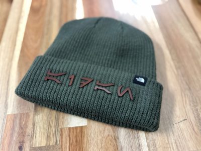 Green North Face beanie with laser cut leather letter branding K17FN custom personalized hat