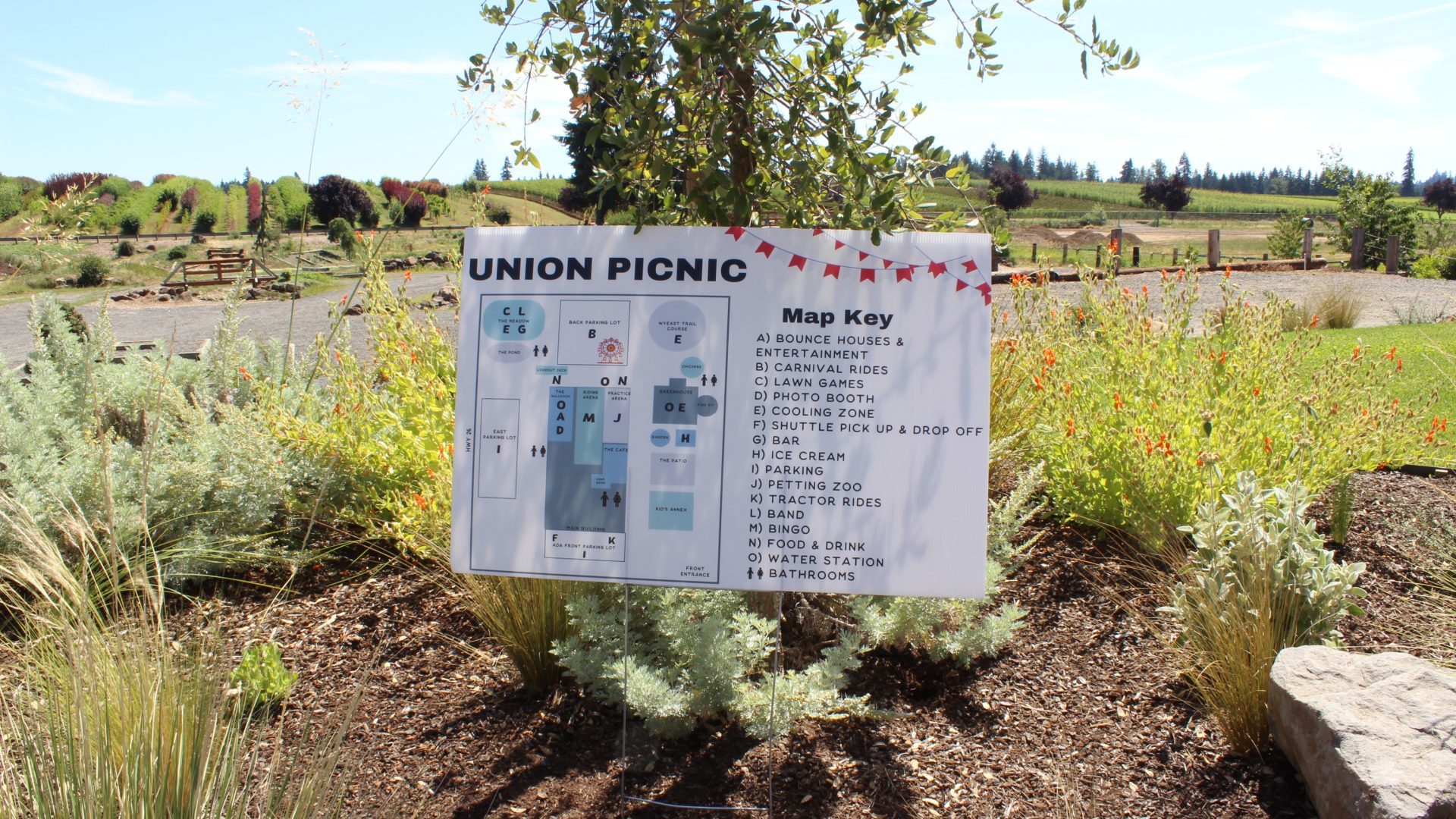 Large printed outdoor event map sign Union Picnic with map key carnival rides lawn games food booths