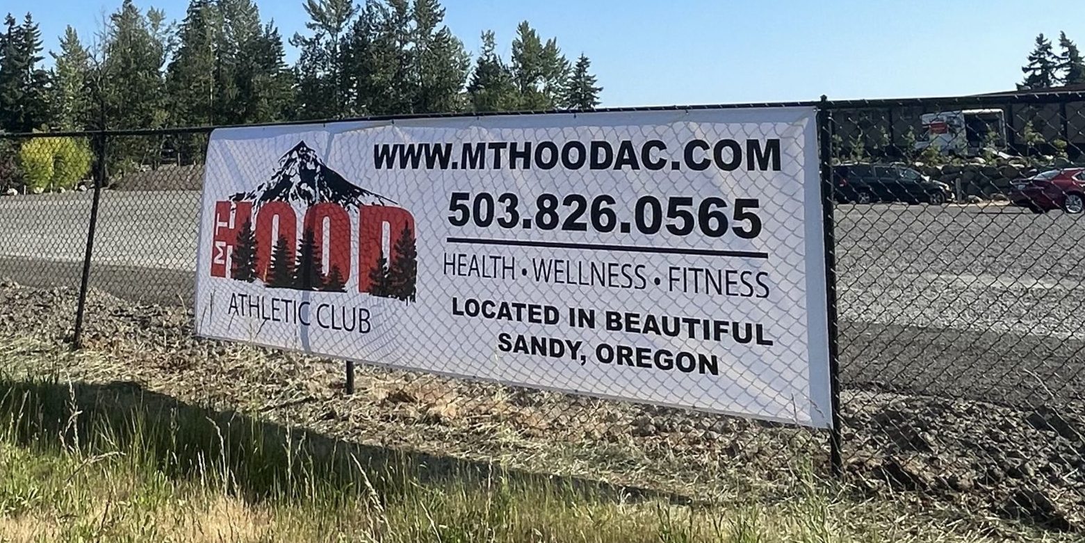 Large vinyl banner Mt Hood Athletic Club health wellness fitness Sandy Oregon with mountain logo